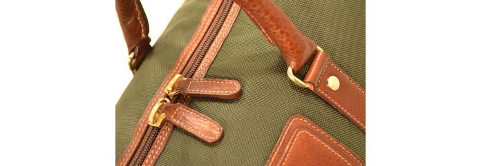 Close up of Ballistic Nylon bad with Leather strapping and hardware